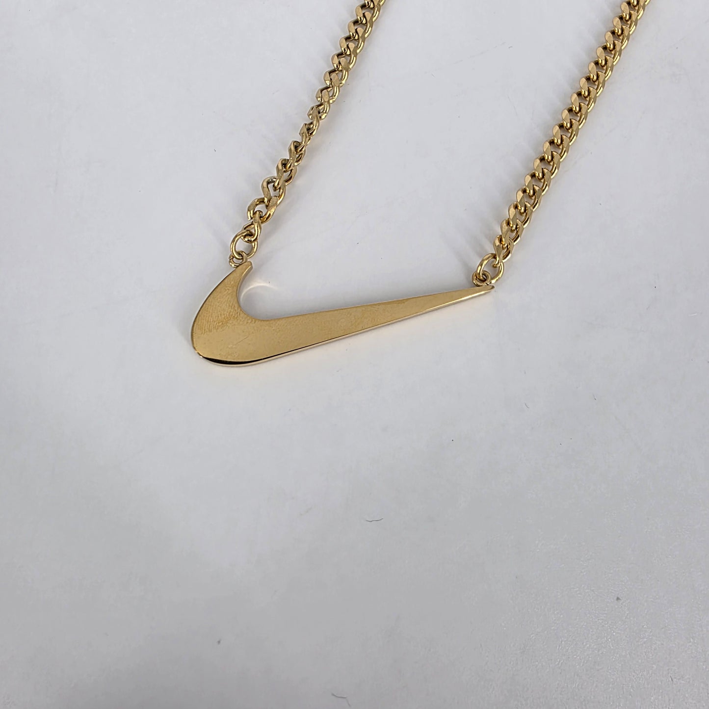 Romela nnaGold Swoosh Signature Necklace: Standalone Swoosh