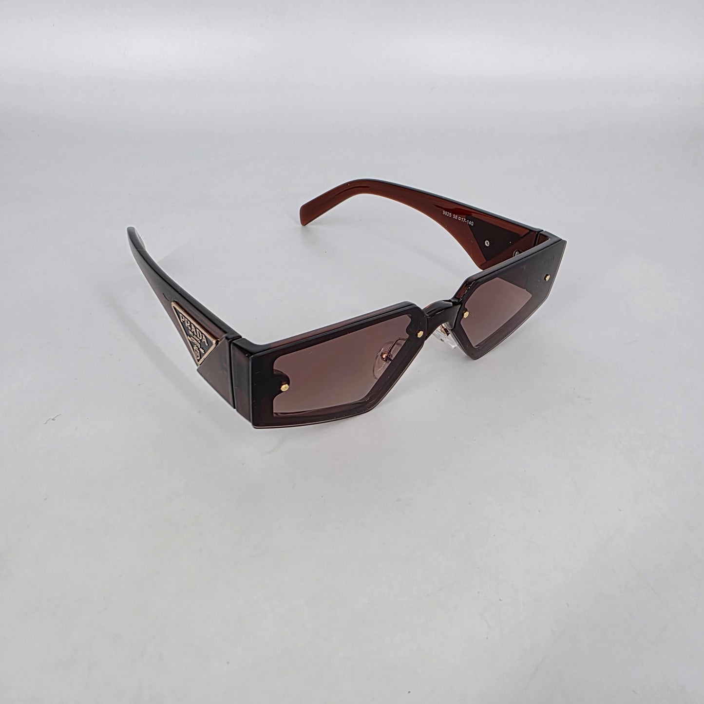 Prada PR58ZS Sunglasses – Brown